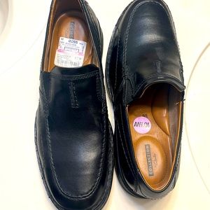 Clarks black loafers.